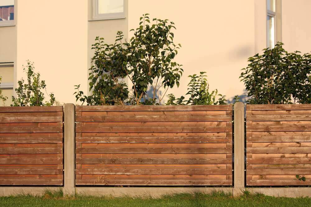 mix of concrete fencing and timber fence sections